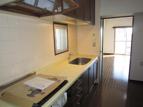 Kitchen. It is bright with a window.