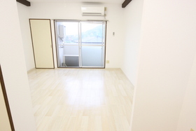 Living and room. It is a bright room that has been unified with white