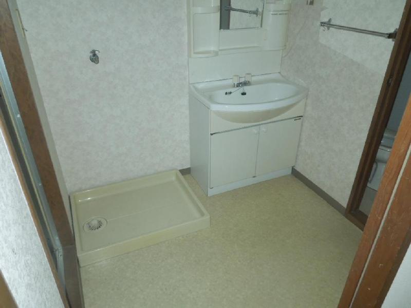 Washroom. Washing machine in the room