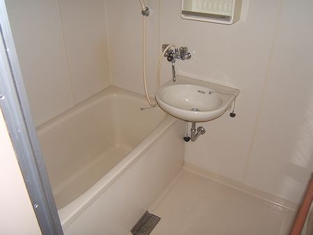 Bath. It is a clean white bath.