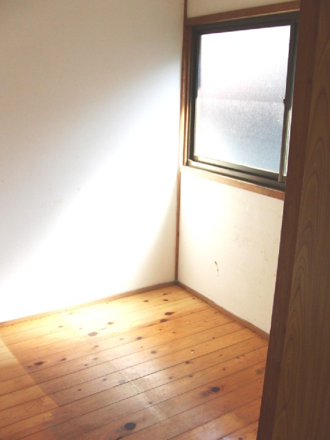 Other room space. It is a photograph of the closet.