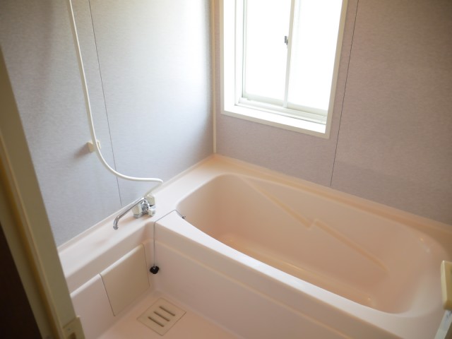 Bath. Small is a window with a bathroom
