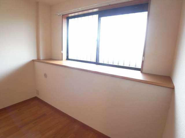 Living and room. It is a bay window.