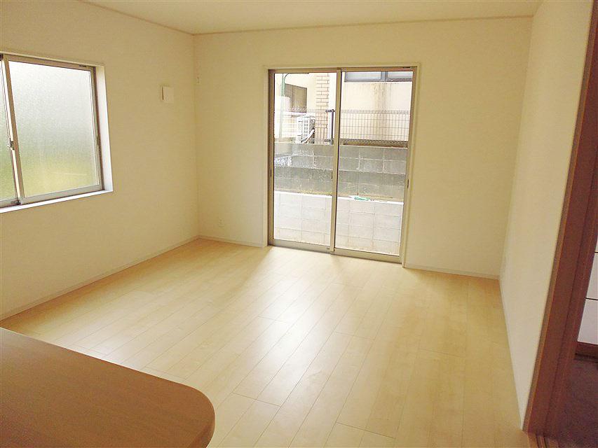 Living. Bright and wide over have living as seen from the kitchen