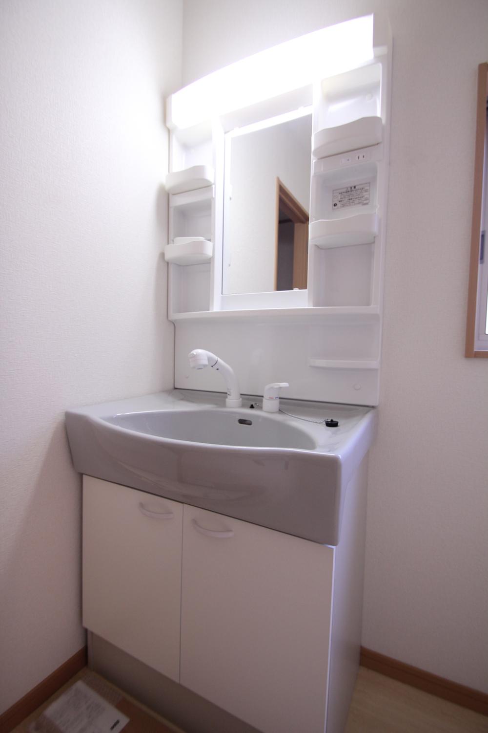 Wash basin, toilet. The photograph is the same type