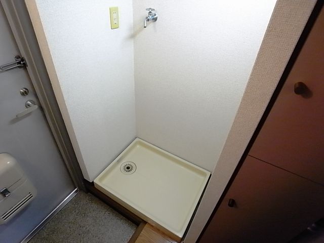 Other room space. Washing machine in the room