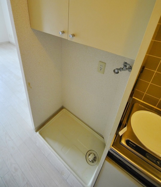 Other Equipment. Washing machine in the room