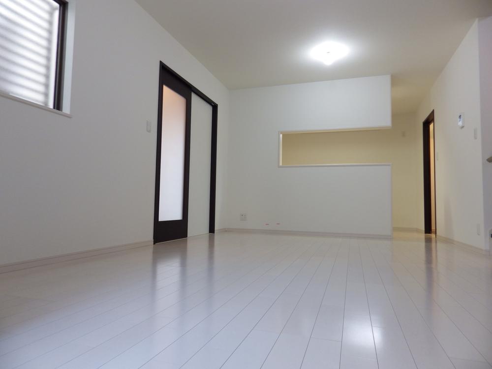 Living. White floor of the living room will brighten up the room. 