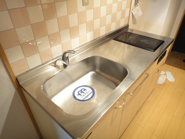 Kitchen. It is with a stove cute kitchen