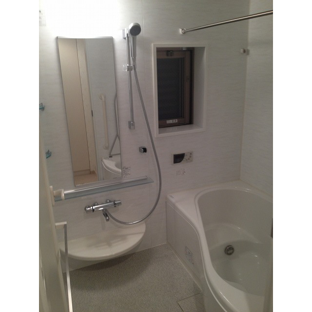 Bath. There is also a window to a large bathroom.