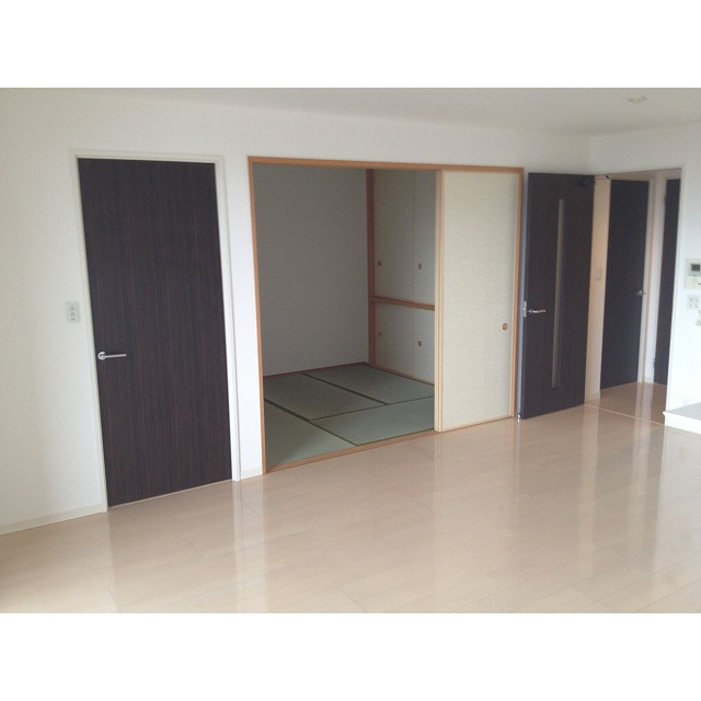 Living and room. Is the view from the kitchen side.