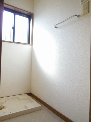 Other room space. Washing machine in the room