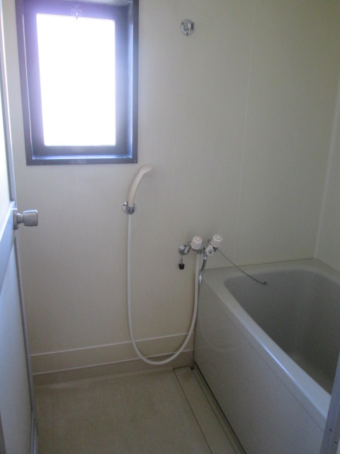 Bath. There is a window is bright.