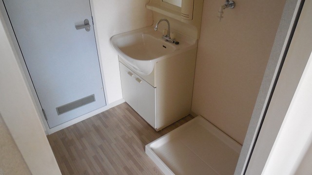 Washroom. Basin for washing machine inside the yard