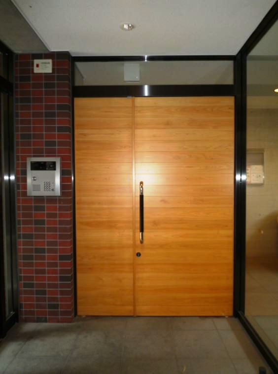 Building appearance. Entrance of the wooden door