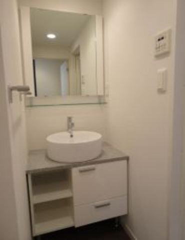 Other room space. Stylish bathroom vanity