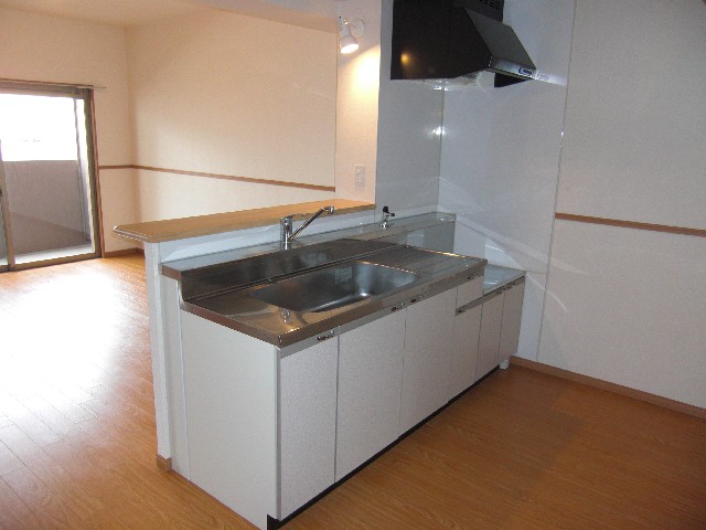 Kitchen. There is no top of the hanging cupboard, Kitchen interior is bright