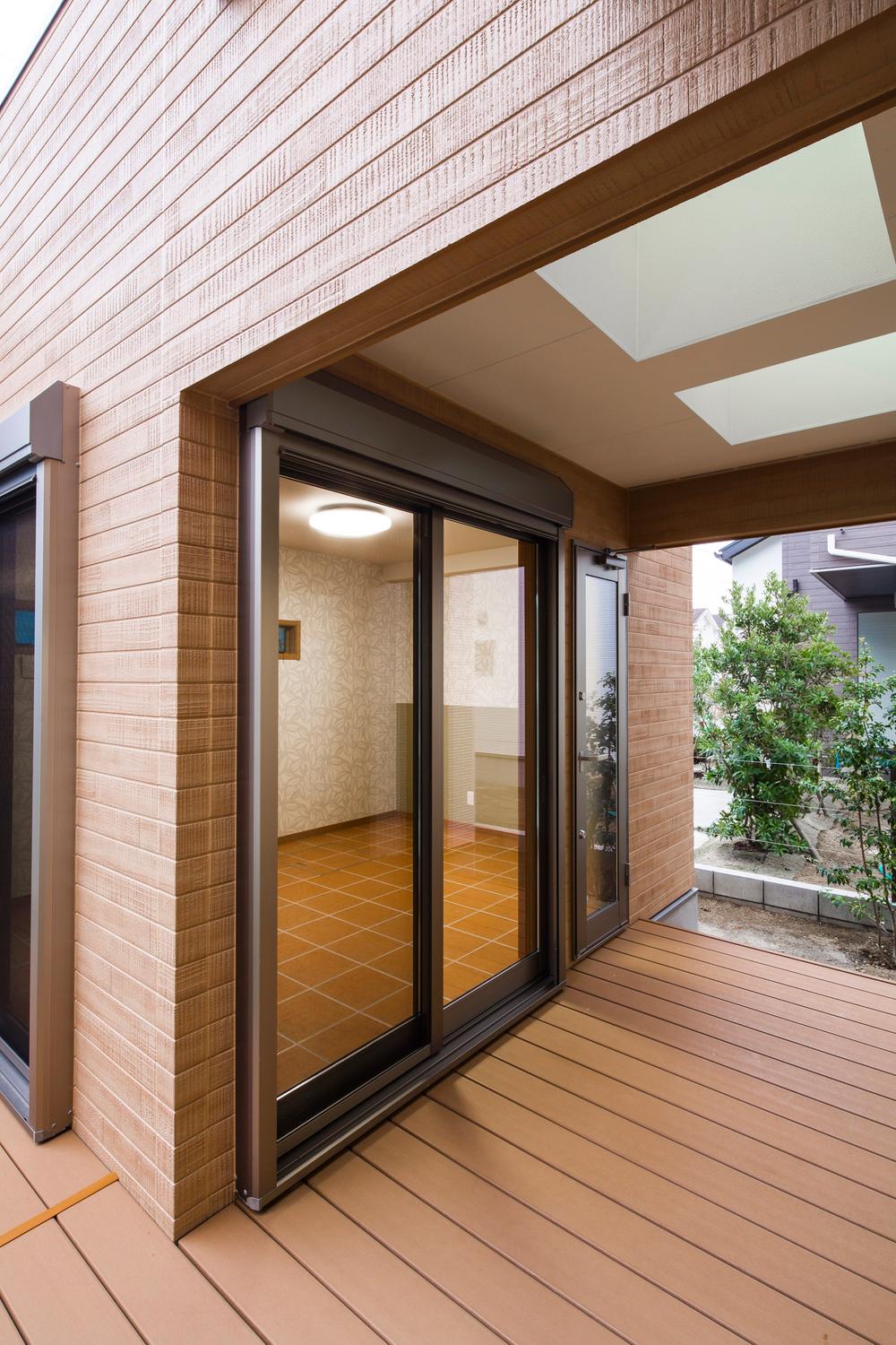 Non-living room. Apart of the room connected by wood deck.
