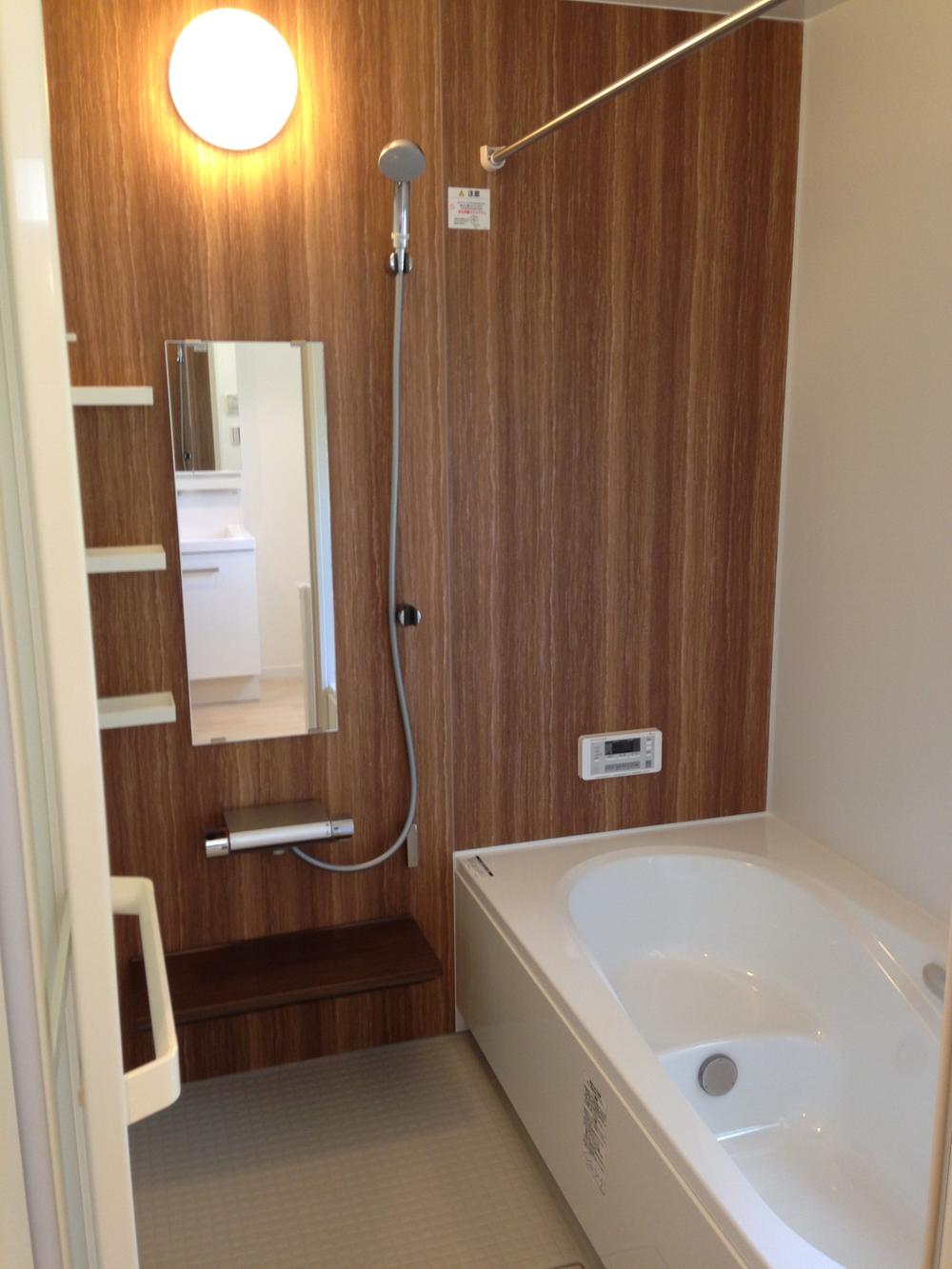 Bathroom. Chic shades of bathroom with heating dryer. Warm even in winter.