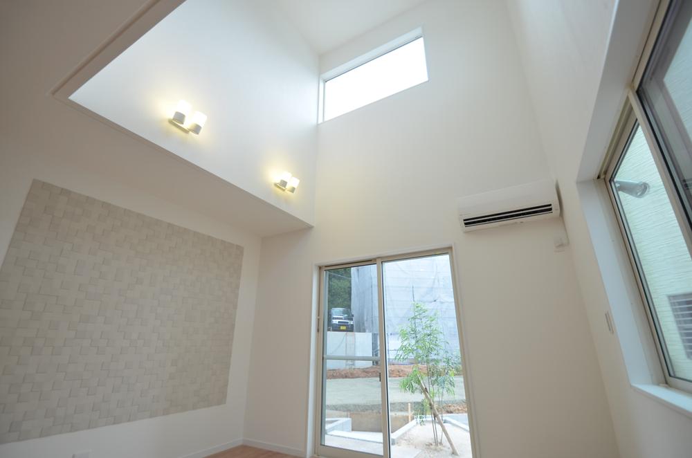 Living. A vaulted ceiling living room is bathed in bright sunshine in the room a certain space.