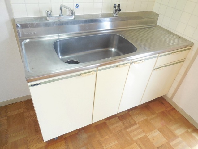 Kitchen. With the top shelf is a kitchen