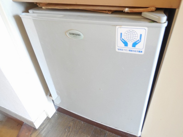 Other room space. There is a refrigerator