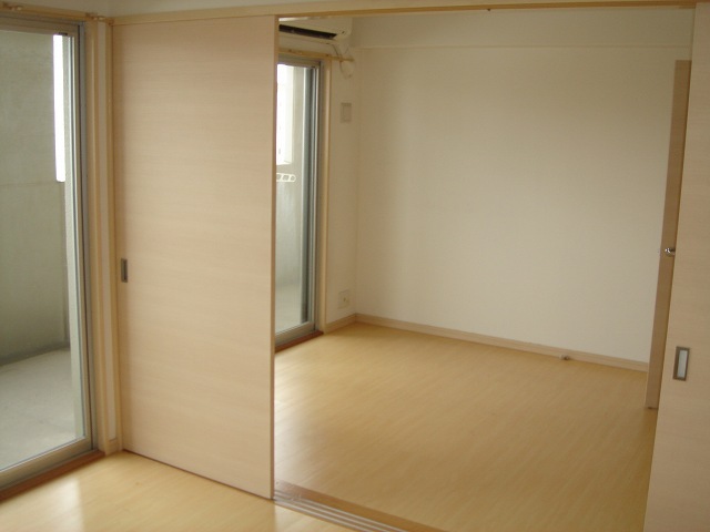 Living and room. The photograph is the same building a separate room