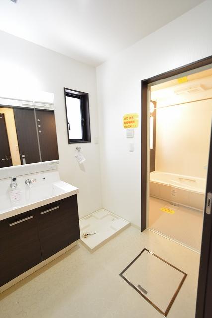 Wash basin, toilet. Wash A wall faucet & high back guard