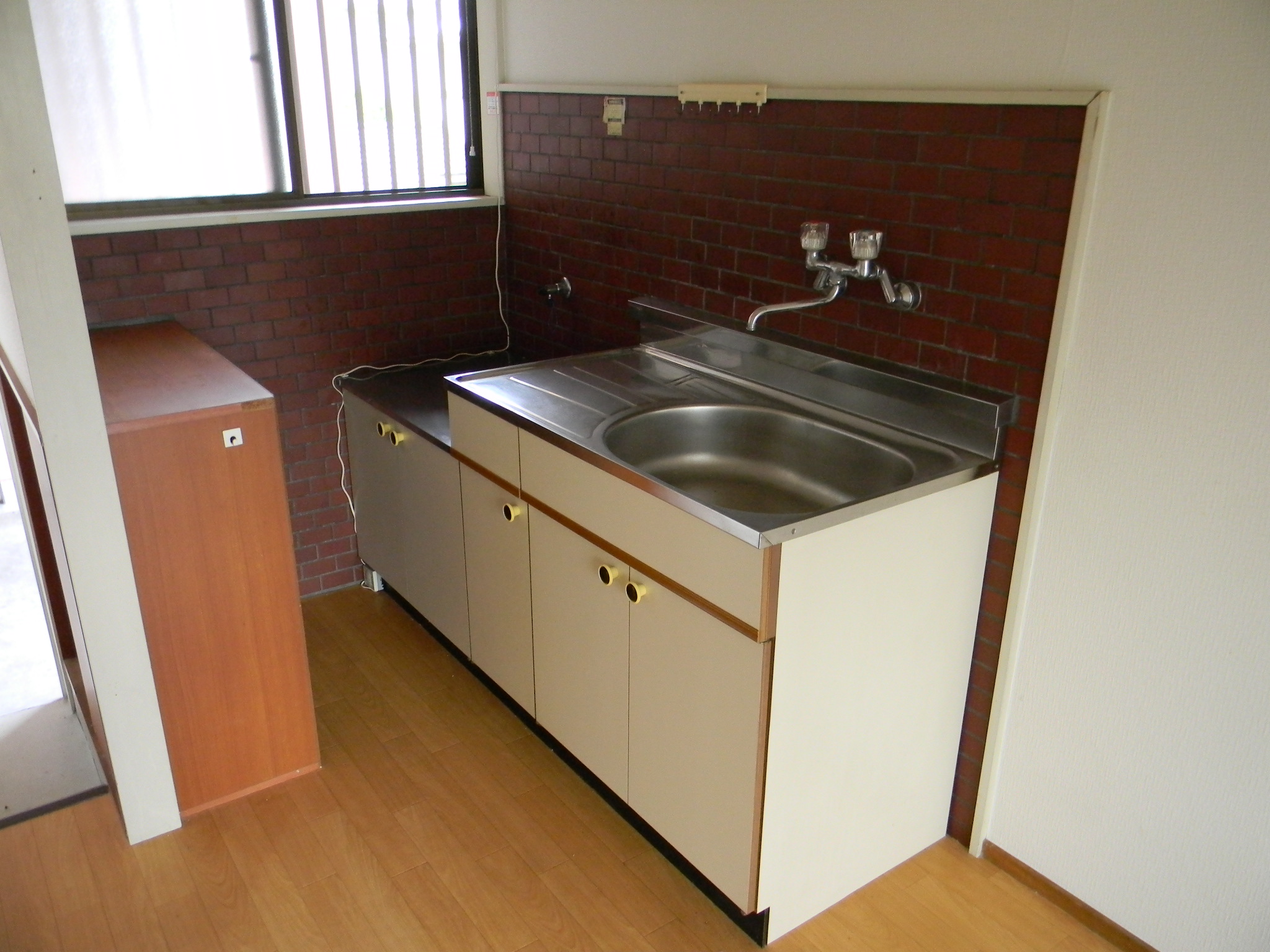 Kitchen. It is bitter brick tiles of the kitchen. 