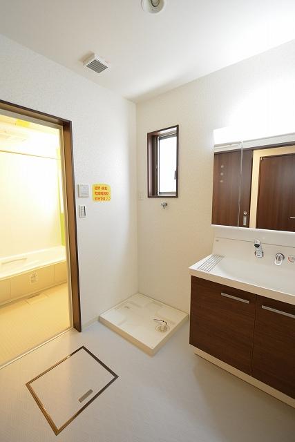 Wash basin, toilet. Wash A wall faucet & high back guard