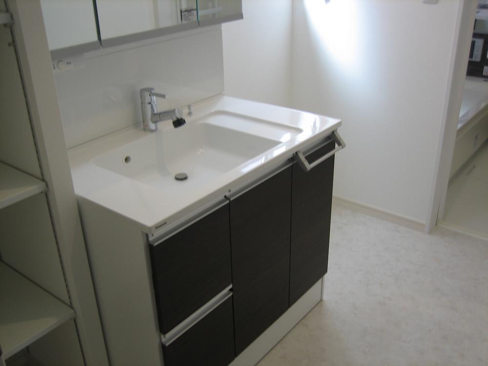 Other Equipment. A lot of storage space in a wide wash basin three-sided mirror of width 900