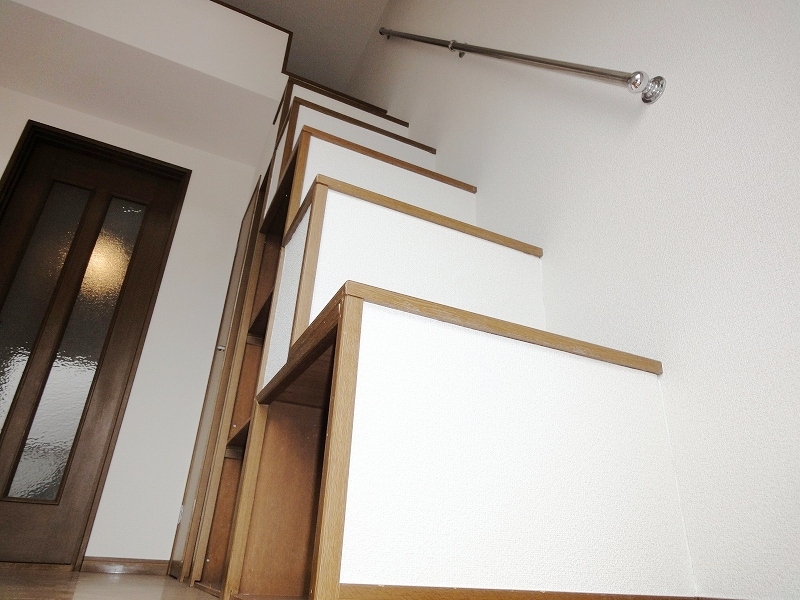 Living and room. Stairs up to the loft has become the storage