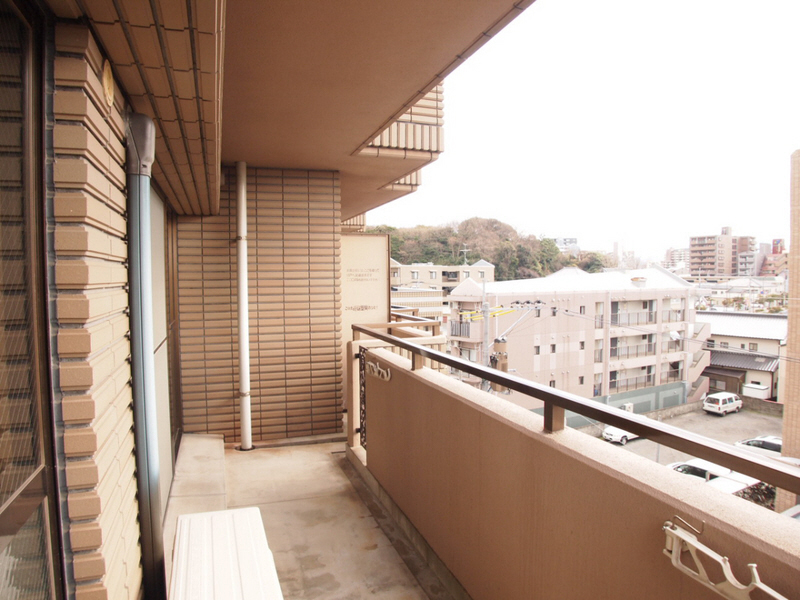 Balcony. Open is not a high building across the street from balcony