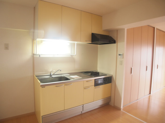 Living and room. Yellow cute kitchen. 