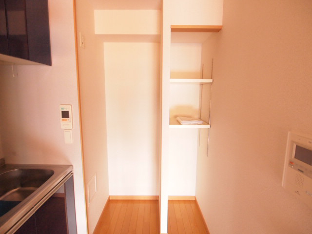 Kitchen. There is also glad storage space and refrigerator storage