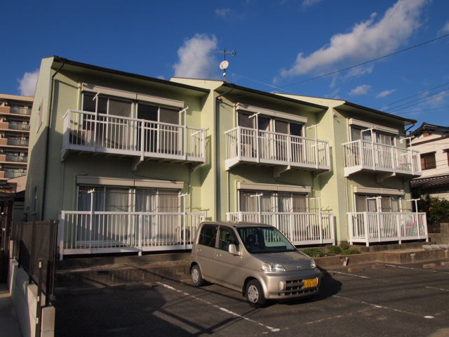 Building appearance. Sunny property. The sun is dazzling.