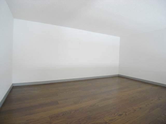 Living and room. Loft space also it's so wide