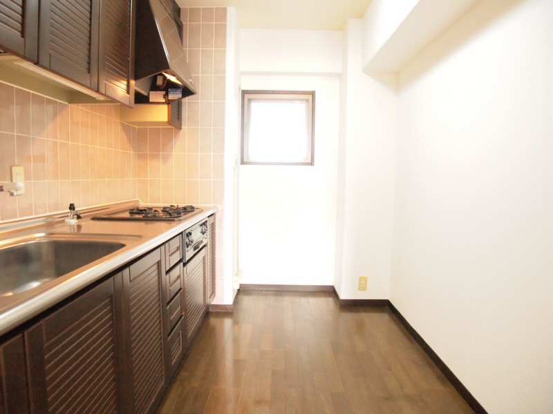 Kitchen. It is also a large kitchen space. 