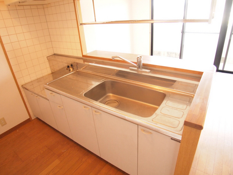 Kitchen. It is a large kitchen with a width. 