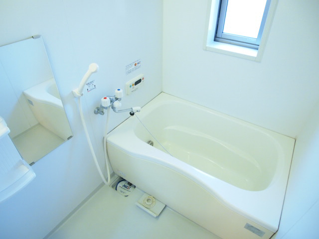 Bath. Spacious bathroom with a window. 