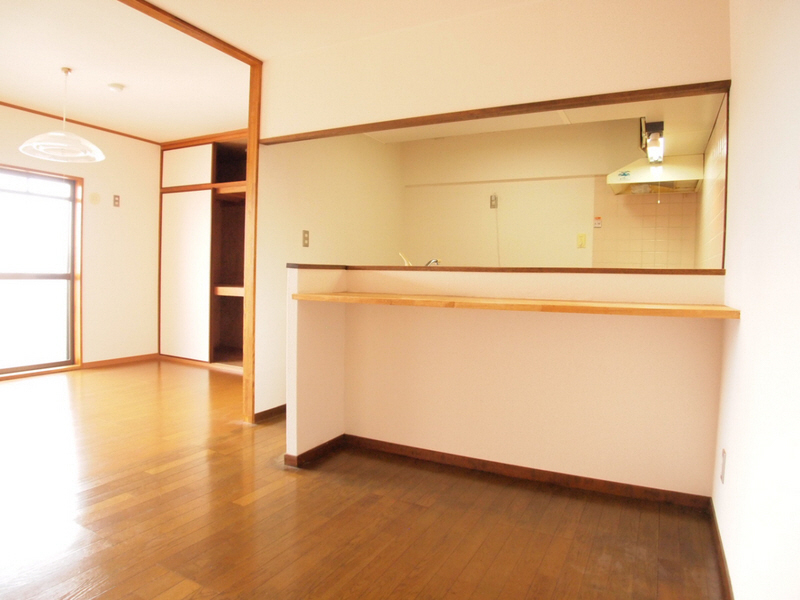 Living and room. It is a useful counter kitchen.