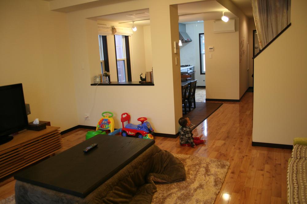 Living. The floor material we use cherry flooring to bring a warm feeling to the family.