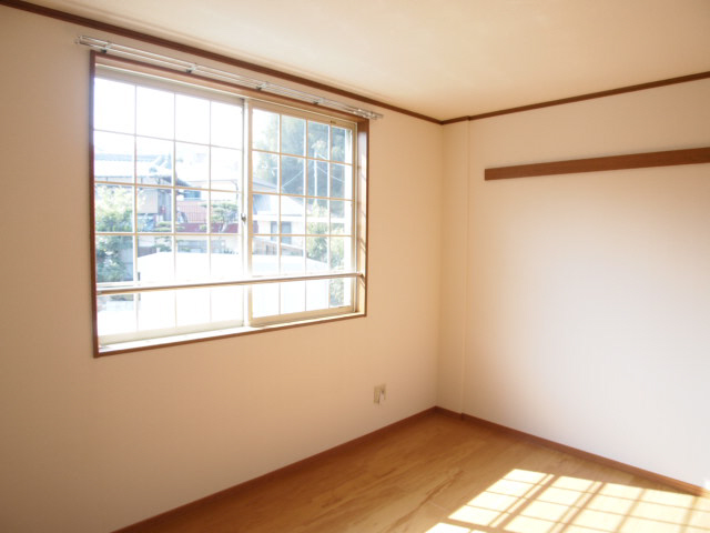 Other room space. A bright room with large windows, This is useful with a hanger rail on the wall.