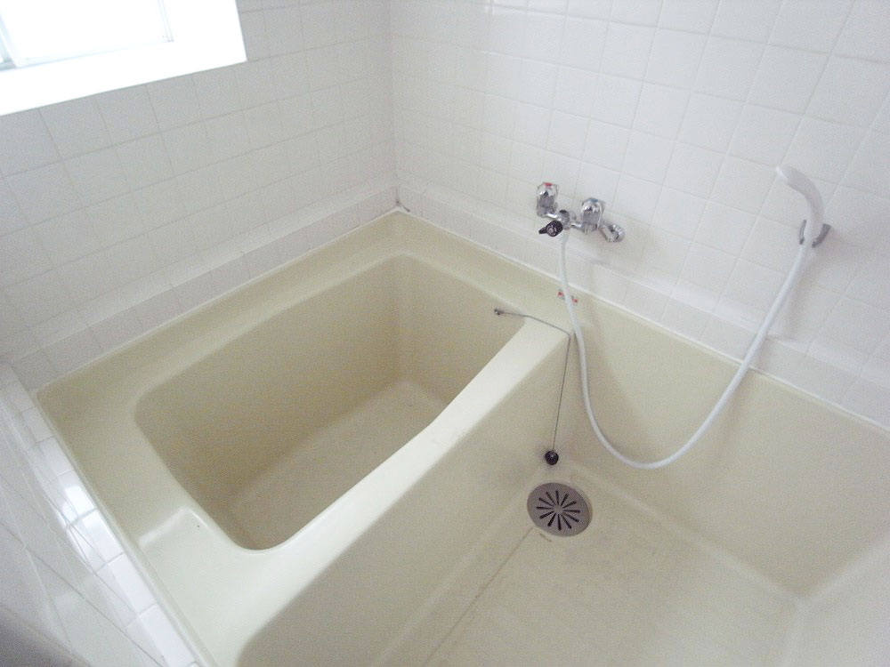 Bath. Hot water and shower and a window with a bath