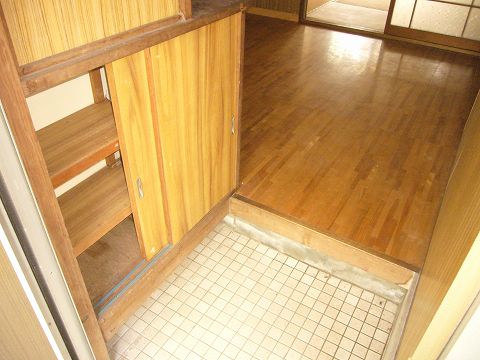 Entrance. Shoes is with a box.