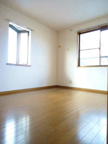 Other room space. There is a window is bright