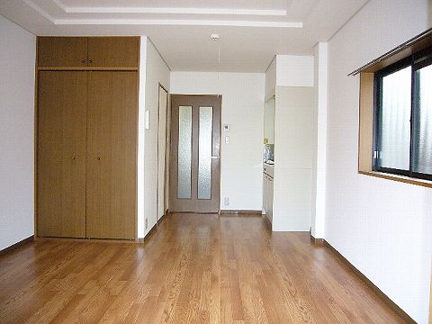 Living and room. It is bright with a bay window.