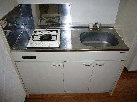 Kitchen. It is a kitchen with a gas stove.