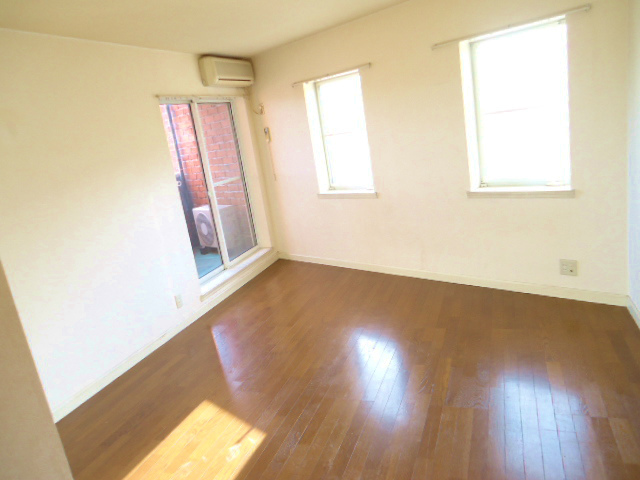 Living and room. There is a window is bright Western-style