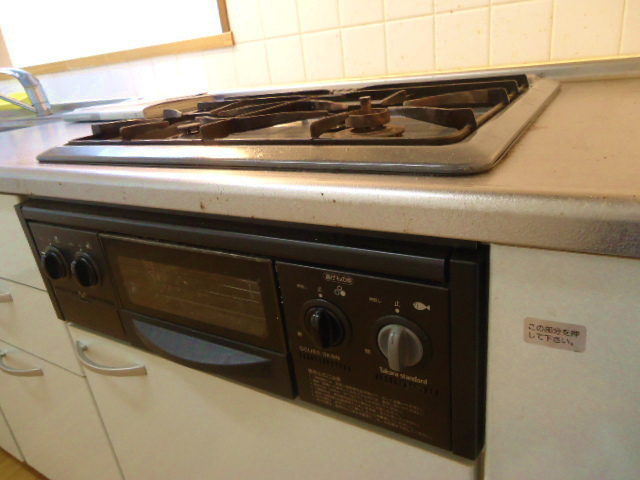 Kitchen. Gas is with a stove grill